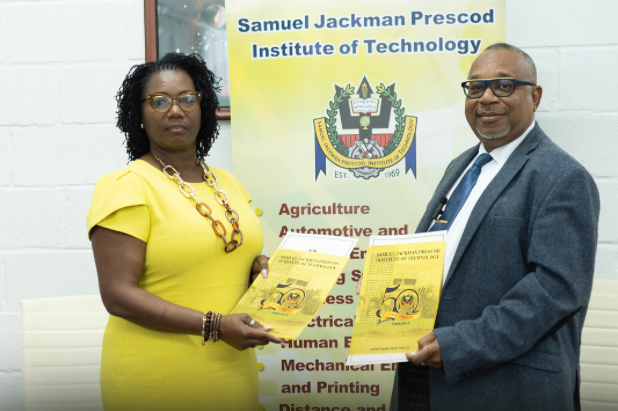 Seilest Bradshaw and Ian Drakes posing with the MOU